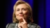 FILE - Former U.S. Secretary of State Hillary Clinton reacts to a question as she discusses her new book "Hard Choices: A Memoir" at George Washington University in Washington, June 13, 2014. 