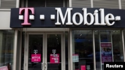 FILE - A T-Mobile store is seen in Manhattan, New York, April 30, 2018. 