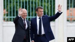 Президент Франції Еммануель Макрон і канцлер Німеччини Олаф Шольц у Мезебергу поблизу Берліна, східна Німеччина, 28 травня 2024 року. (Фото^ Odd ANDERSEN / AFP)