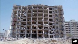 FILE - A June 30, 1996, photo shows a general view of the destroyed Khobar Towers in Dhahran, Saudi Arabia.