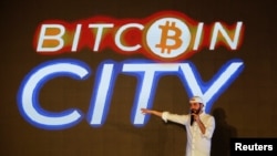 FILE - El Salvador's president Nayib Bukele speaks at the closing party of “Bitcoin Week” where he announced the plan to build the first "Bitcoin City" in the world, in Teotepeque, El Salvador, Nov. 20, 2021. 