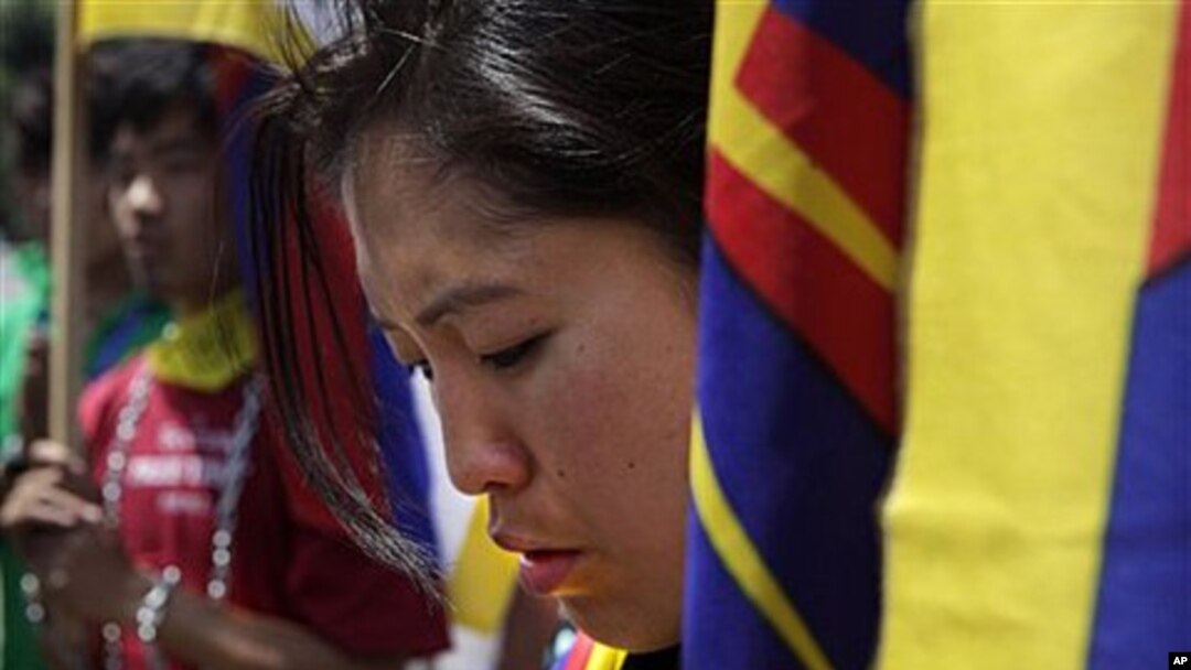 Tibetan students pray outside Rajghat, the memorial of Mahatma Gandhi, during a march demanding immediate withdrawal of Chinese troops from Kirti Monastery in Tibet, in New Delhi, India, April 19, 2011