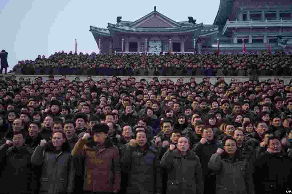 Participants gesture during a mass demonstration in support of a new year address made by North Korean leader Kim Jong-Un at Kim Il-Sung square in Pyongyang.