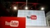 FILE - Signs inside the YouTube Space LA offices in Los Angeles, Oct. 21, 2015.