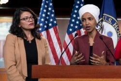 FILE - U.S. Reps. Ilhan Omar, right, and Rashida Tlaib, both Democrats, are seen during a news conference at the Capitol, in Washington, July 15, 2019.