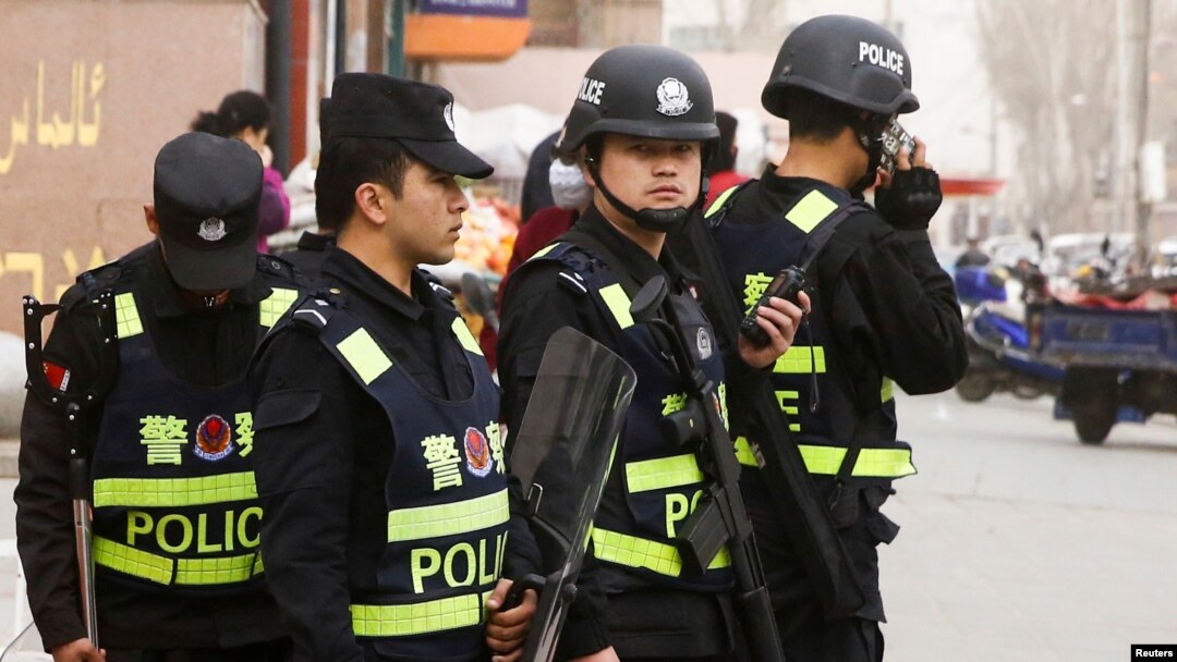 Armed police keep watch in a street in Kashgar, Xinjiang Uighur Autonomous Region, China, March 24, 2017. 