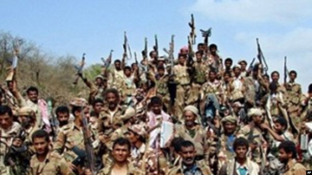 Yemeni soldiers and tribe members after a battle against al-Houthi Shiite rebels in northern Yemen. Al-Qaida is coordinating with the rebels battling Yemeni and Saudi government forces along the border, 24 Jan 2010