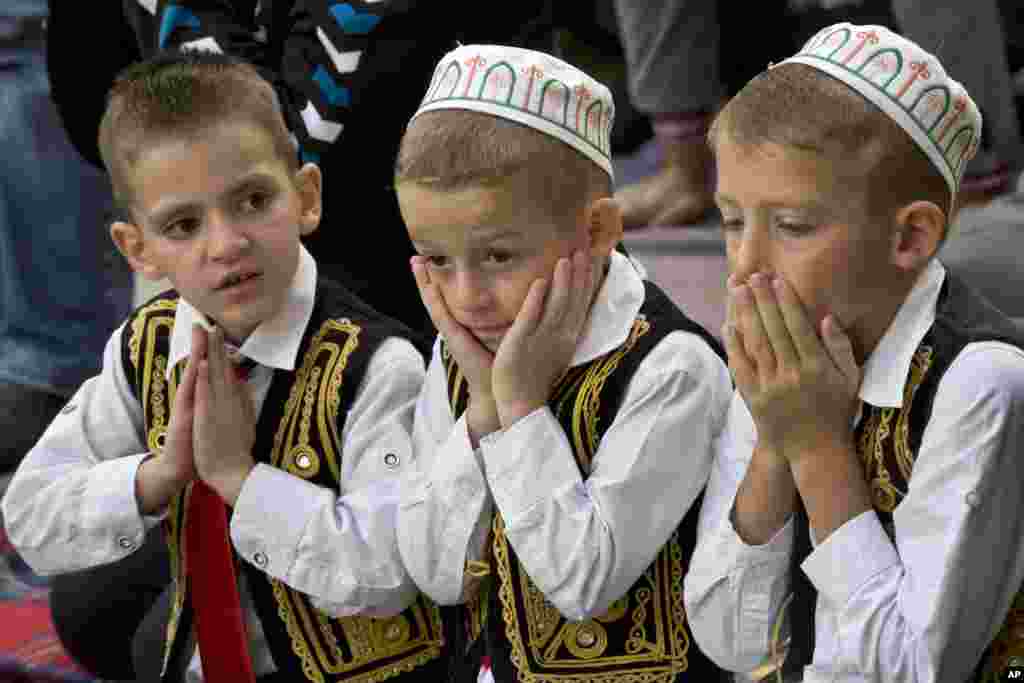 Children pray during Eid al-Adha outside Sultan Mehmet Fatih mosque in capital Pristina, Kosovo.