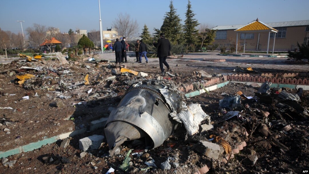 Rescue teams work after a Ukrainian plane carrying 176 passengers crashed near Imam Khomeini airport in the Iranian capital Tehran early in the morning on January 8, 2020, killing everyone on board. (Photo by AFP)