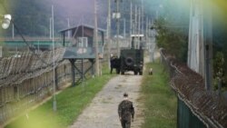A South Korean soldier walks along a military fence near the demilitarized zone separating the two Koreas in Paju, South Korea, September 28, 2021.
