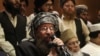 Pakistani religious cleric and member of Taliban's negotiating committee Maulana Sami-ul-Haq speaks during a press conference in Lahore, Pakistan, Feb. 15, 2014.