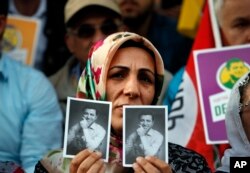Supporters of the pro-Kurdish Peoples' Democratic Party (HDP) some holding pictures of the party's former co-leader Selahattin Demirtas, in prison on charges of leading a terror organization, chant slogans during a rally.