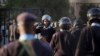 FILE - Riot police are ordered inside the Parliament building itself as chaos between MPs erupts inside, in Nairobi, Kenya, Dec. 18, 2014.