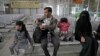 A Yemeni family waits in the departure hall at Sanaa International airport for a U.N. flight, Yemen, Feb. 3, 2020. The United Nations medical relief flight carrying patients from Yemen's rebel-held capital was the first in over three years. 