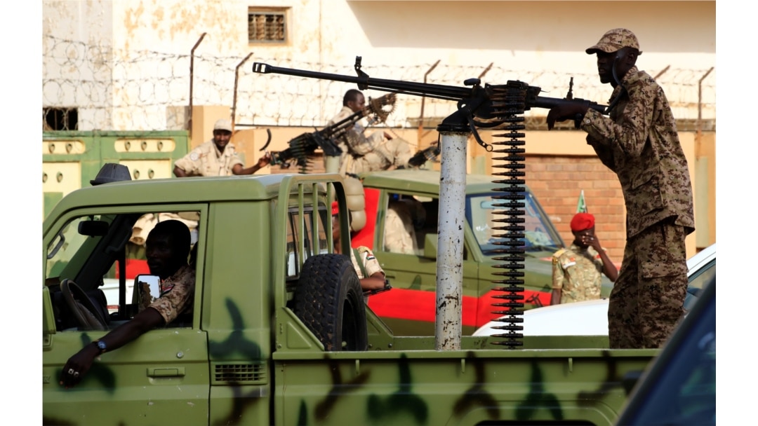 Sudanese soldiers secure the area as Sudan's ex-president Omar al-Bashir leaves the office of the anti-corruption prosecutor in Khartoum, Sudan, June 16, 2019.
