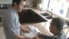 Asian-American voter Hugh Tra and his father.