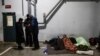 Migrants rest at the transport and logistics centre Bruzgi on the Belarusian-Polish border, in the Grodno region, Belarus, Dec. 21, 2021. 