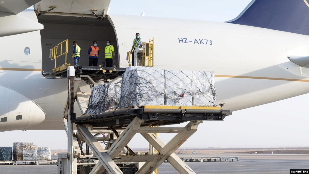 Staff members of King Salman Humanitarian Aid and Relief Center unload humanitarian aid at Beirut International airport to provide support following Tuesday's blast, Lebanon, August 8, 2020.