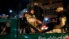 Afghan security personnel arrive near the Serena hotel, during an attack in Kabul, March 20, 2014. 