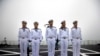 Chinese sailors stand on the deck of the naval training ship Qi Jiguang during a naval parade to commemorate the 70th anniversary of the founding of China's PLA Navy in the sea near Qingdao in eastern China's Shandong province, Tuesday, April 23, 2019.