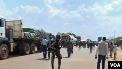 Troops from C.A.R. and Cameroon gather to escort trucks in Garoua Boulai, Cameroon, June 18, 2019. (M. Kindzeka/VOA)