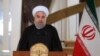 In this photo released by his office, Iranian President Hassan Rouhani addresses his nation in a televised speech, in Tehran, Oct. 13, 2017. Rouhani spoke after U.S. President Donald Trump angrily accused Iran of violating the spirit of the 2015 nuclear accord and demanded Congress toughen the law governing U.S. participation.