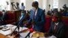 Merdad Segona, center, lawyer for former Ugandan presidential candidate Robert Kyagulanyi, aka Bobi Wine, speaks during a civil court hearing in Kampala, Jan. 21, 2021, to seek an end to house arrest for Kyagulanyi and his wife.
