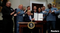 FILE - U.S. President Donald Trump is pictured after signing a proclamation to establish tariffs on imports of steel and aluminum, at the White House in Washington, March 8, 2018.