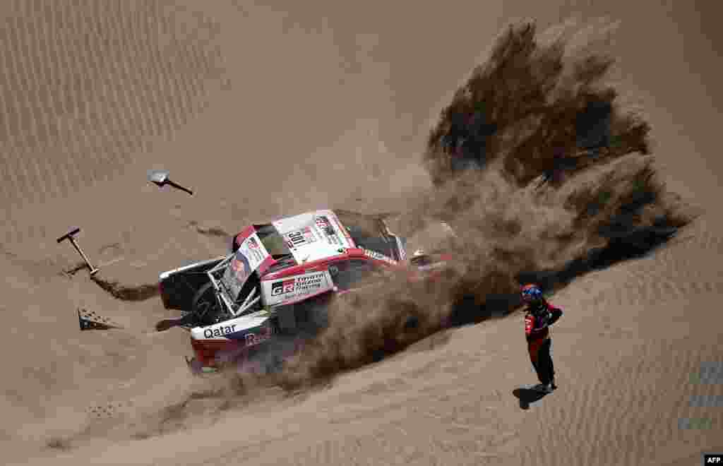 Toyota's driver Nasser Al-Attiyah of Qatar and his co-driver Matthieu Baumel of France get stuck in the sand dunes during Stage 4 of the Dakar 2018, in and around San Juan De Marcona, Peru, on Jan. 9, 2018.