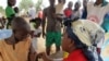 FILE - A child receives a measles vaccine in Nangungue, eastern Cameroon, April 12, 2013.
