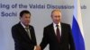 Russian President Vladimir Putin (R) shakes hands with Philippine's President Rodrigo Duterte prior to their meeting at the Valdai Discussion Club in Sochi, Russia, Oct. 3, 2019.