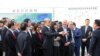 FILE - Taiwan's Kaohsiung Mayor Han Kuo-yu, center, visits the Xiamen International Cruise Center in Fujian province, China, March 26, 2019. 