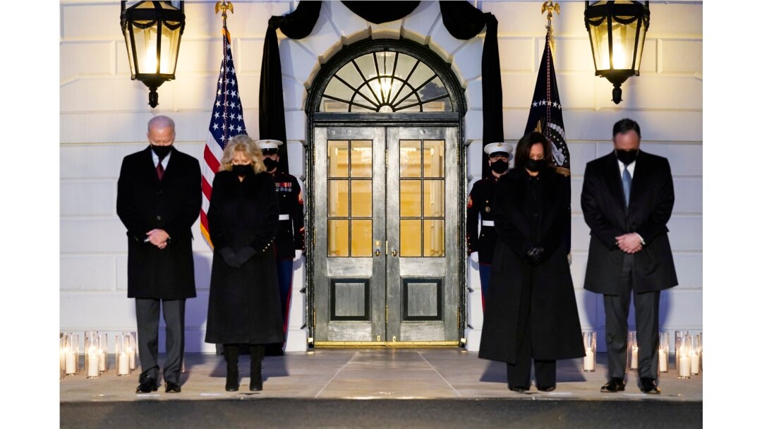 President Joe Biden, First Lady Jill Biden, Vice President Kamala Harris and her husband Doug Emhoff, bow their heads during a ceremony to honor the 500,000 Americans that died from COVID-19, at the White House, Monday, Feb. 22, 2021, in Washington. (AP Photo/Evan Vucci)