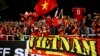 Vietnam's spectators cheers during the AFF Suzuki Cup final match between Vietnam and Malaysia at My Dinh stadium in Hanoi, Vietnam Dec. 15, 2018.
