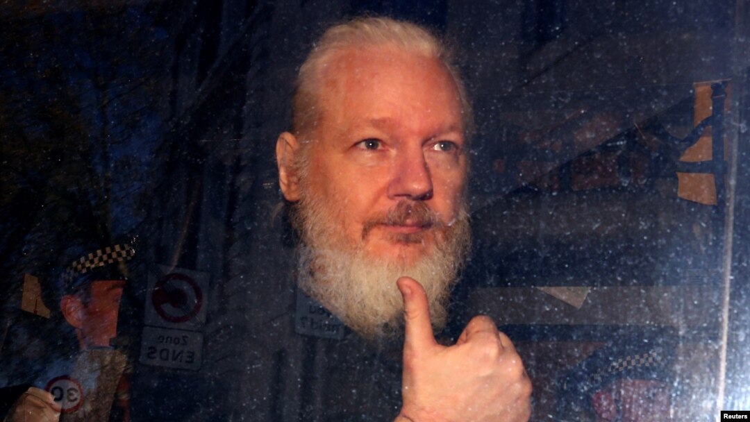 WikiLeaks founder Julian Assange arrives at the Westminster Magistrates Court, after he was arrested in London, Britain, April 11, 2019. 