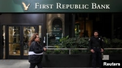 FILE - A security guard stands outside a First Republic Bank branch in San Francisco, California, April 28, 2023.