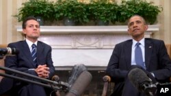 President Barack Obama hosts a bilateral meeting with Mexican President Enrique Peña Nieto, Jan. 6, 2015, in the Oval Office of the White House.