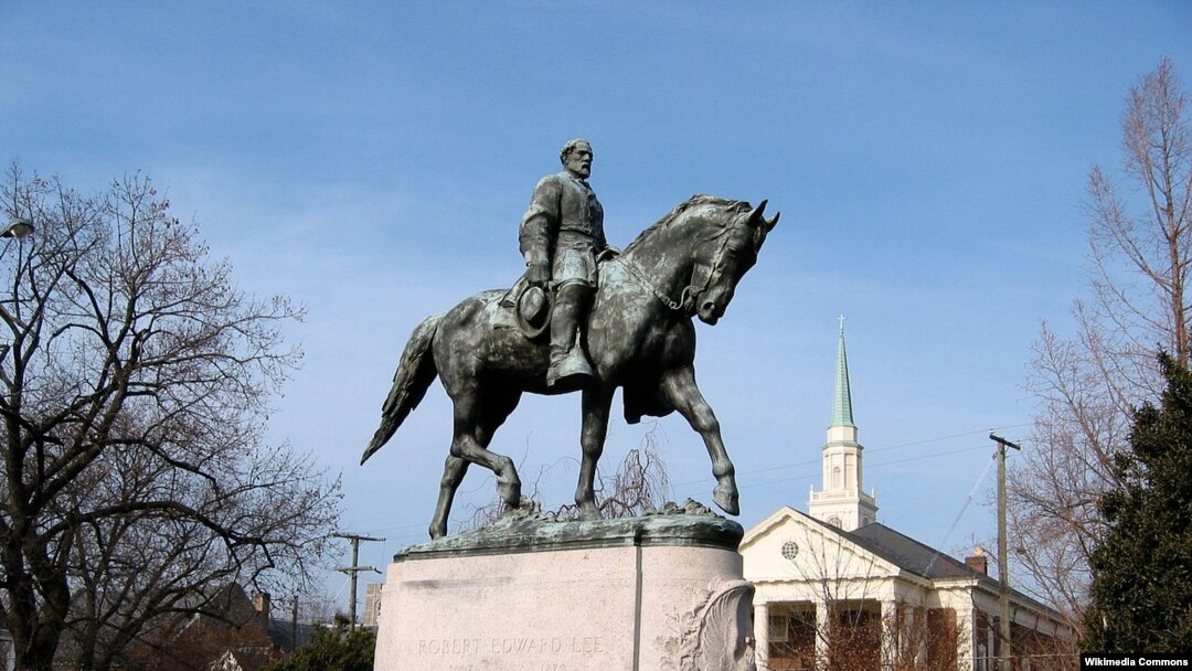 FILE - A statue of Confederate General Robert E. Lee in Charlottesville, Va. 