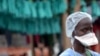 FILE - A health worker stands at Elwa hospital in Monrovia, Sept. 7, 2014. Two previous attempts to declare Liberia free of the virus ended when infections re-emerged.