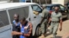 FILE - Men arrested in connection with Cameroon's anglophone crisis are seen at the military court in Yaounde, Cameroon, Dec. 14, 2018. Ten leaders of the separatist movement were sentenced to life in prison, Aug. 20, 2019.