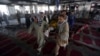 Men carry the coffin of a victim of a suicide attack at a Shiite mosque, Aug. 26, 2017, in Kabul, Afghanistan.