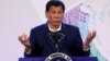 FILE - Philippines' President Rodrigo Duterte gestures during a news conference at the Association of South East Asian Nations (ASEAN) summit in Pasay, metro Manila, Philippines, Nov. 14, 2017.
