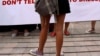 FILE - A woman wearing a miniskirt takes part in a protest in Jakarta against the idea that provocatively dressed women are to blame for sexual assaults.