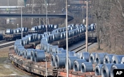 FILE - Steel coils sit on wagons when leaving the thyssenkrupp steel factory in Duisburg, Germany, March 2, 2018. President Donald Trump risks sparking a trade war with his steep tariffs on steel and aluminum imports, German officials and industry groups have said.