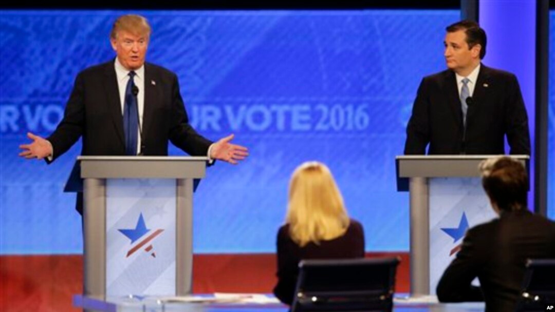Republican presidential candidate, businessman Donald Trump answers a question as Republican presidential candidate, Senator Ted Cruz of Texas listens during a Republican presidential primary debate on Feb. 6. Candidates are talking often about their religious beliefs. (AP Photo/David Goldman)