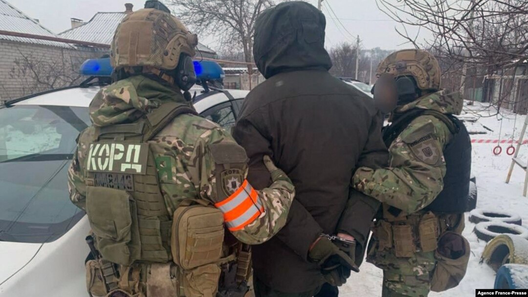 This handout photograph taken from the official Facebook account of the Ukrainian Ministry of Internal Affairs on Jan. 27, 2022, shows the arrest of Artemiy Ryabchuk in Dnipro.