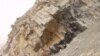 FILE - Limestone layers in between volcanic ash beds from Meishan, China, during the "Great Die-Off" (Courtesy: Shuzhong Shen).