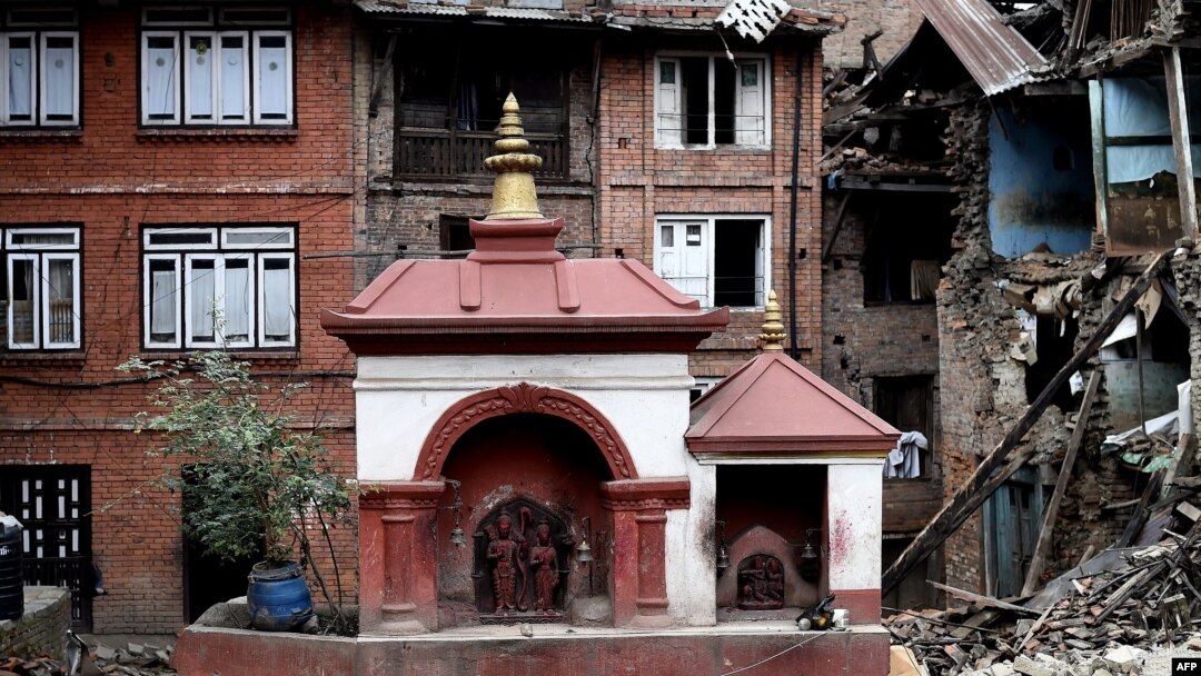FILE - A small temple structure is seen undamaged amidst rubble of damaged buildings at the heritage town of Bhaktapur on April 29, 2015.