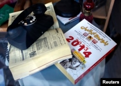 FILE - An Iranian-American phone directory is seen in a store window in the Westwood district of Los Angeles, near Persian Square. The area is home to many migrants from Iran.