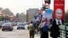 Posters of Russian President Vladimir Putin hang on light poles on Qasr El Nile Bridge in Cairo, Egypt, Feb. 9, 2015.